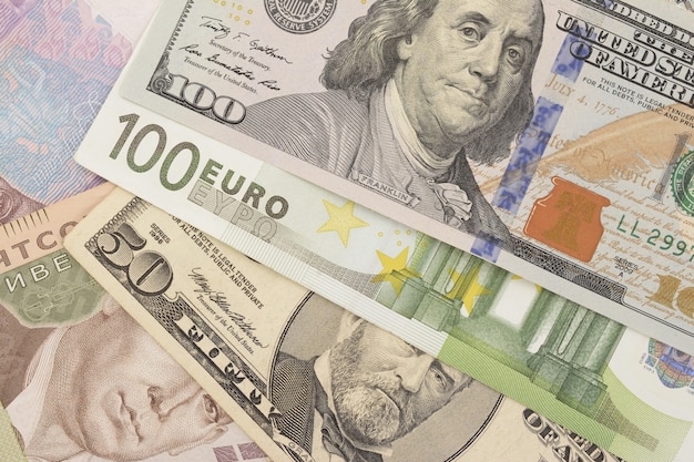 Dollars, euro and hryvnia closeup as background