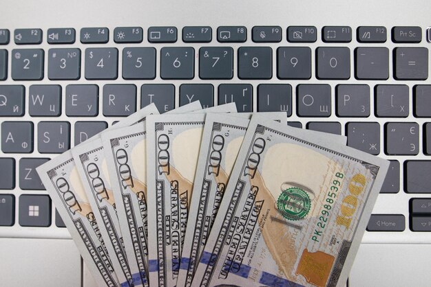 Photo dollars on laptop keyboard