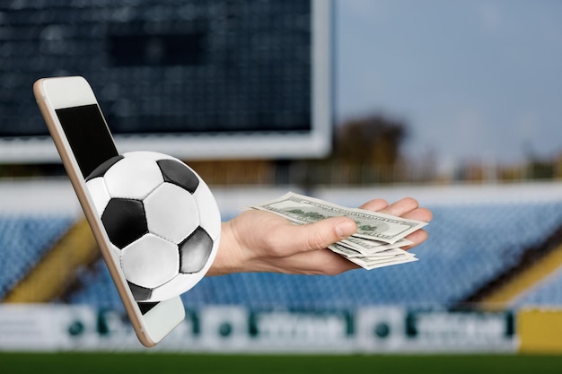 Photo dollars and the soccer ball. sports betting, soccer betting, gambling, bookmaker, big win