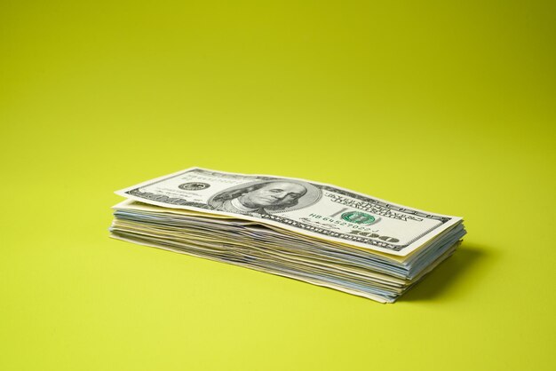 Dollars stack on green background