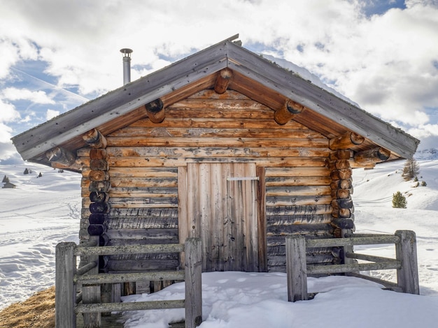 Dolomites snow panorama wooden hut val badia armentarola