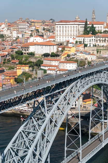 Dom Luis I Bridge view with subway train track and tourists