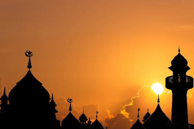 Dome mosques on sunset sky in the evening.