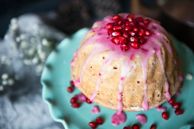 Photo dome shaped cake topped with pomegranate