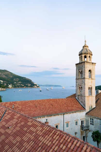 Dominican monastery belfry and Adriatic Sea, Dubrovnik late in the evening, in Croatia