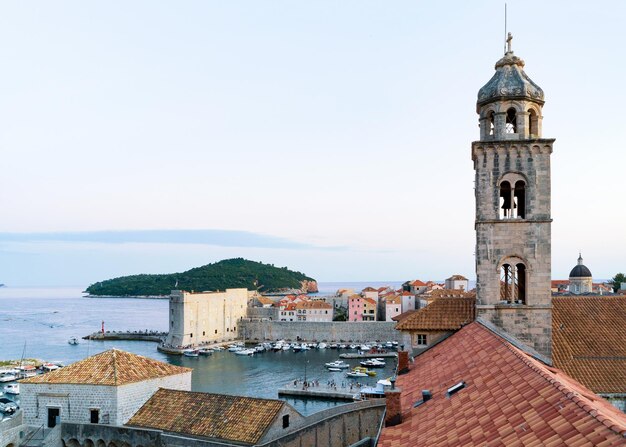 Dominican monastery church belfry and Adriatic Sea, Dubrovnik late in the evening, in Croatia