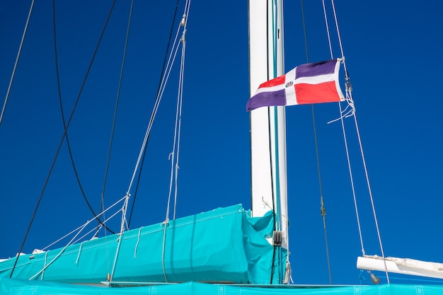 Dominican Republic flag on the sail boat.