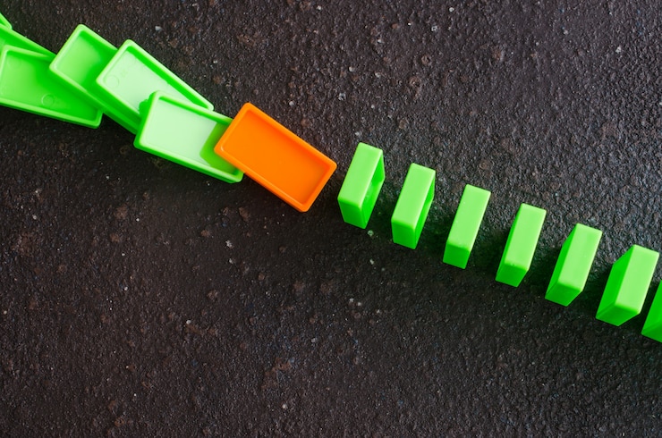 Photo domino effect. the concept of a weak link.