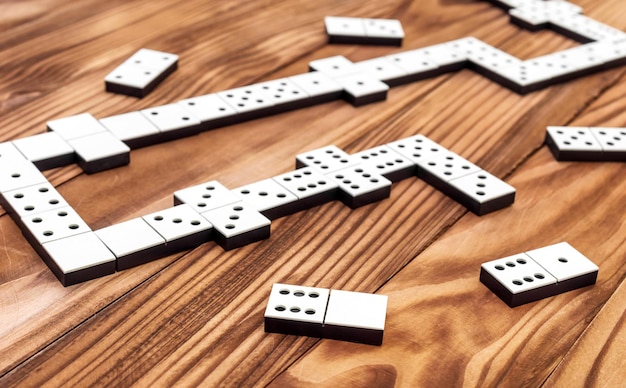 Domino game on the wooden table