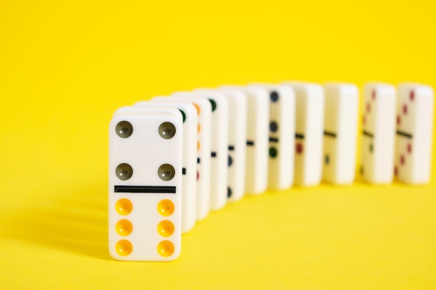 Domino knuckles on a yellow background domino effect