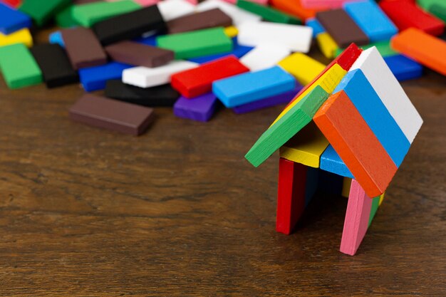 The domino multi color build home on wood table.