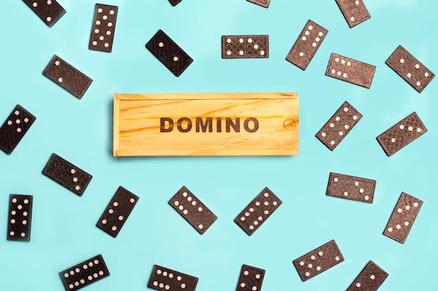 Domino pieces on a light blue background in a top view