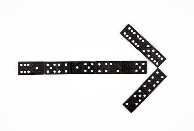 Domino Tiles Strategy Game Stones. Dominoes is a family of tile-based games played with rectangular "domino" tiles. Each domino is a rectangular tile with a line dividing its face into two square ends