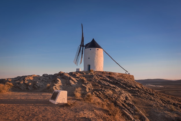 Don Quixote windmills at sunset. Famous landmark in Consuegra, Toledo Spain.