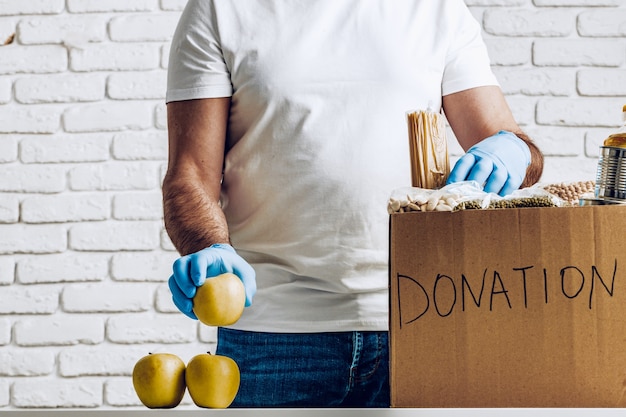 Photo donation box of food for people suffering from coronavirus pandemia consequences