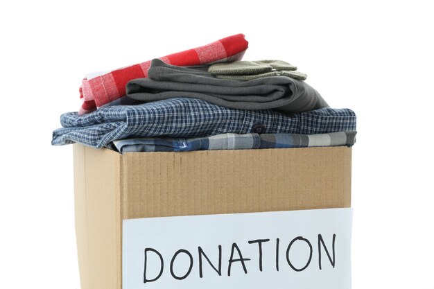 Donation box with clothes isolated on white background