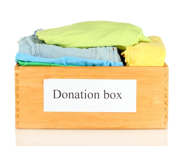 Donation box with clothing isolated on white