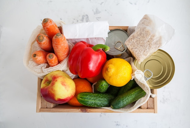 Donation wooden box with various food.