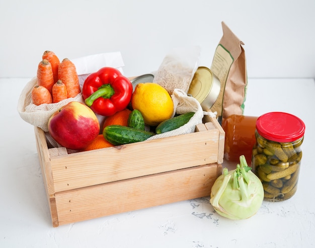 Donation wooden box with various food.