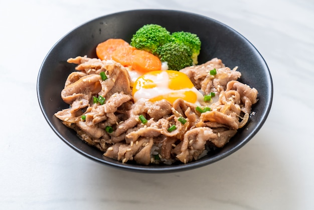 donburi, pork rice bowl with onsen egg and vegetable