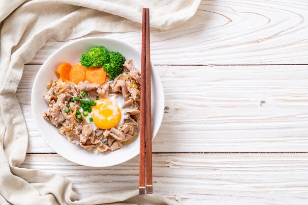 donburi, pork rice bowl with onsen egg and vegetable