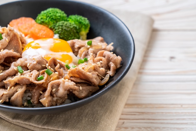 donburi, pork rice bowl with onsen egg and vegetable