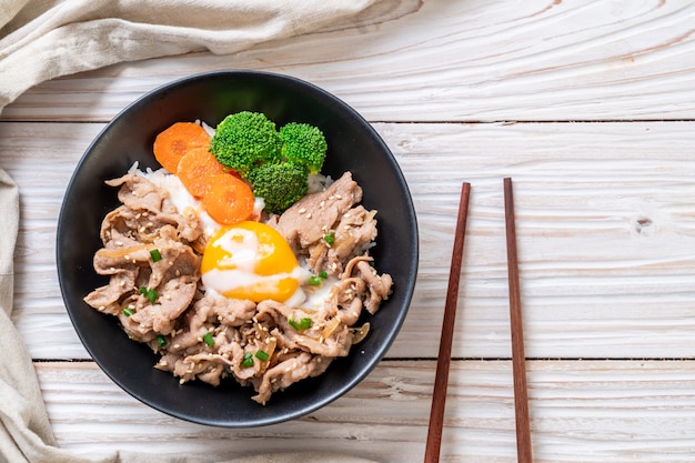 Photo donburi, pork rice bowl with onsen egg and vegetable