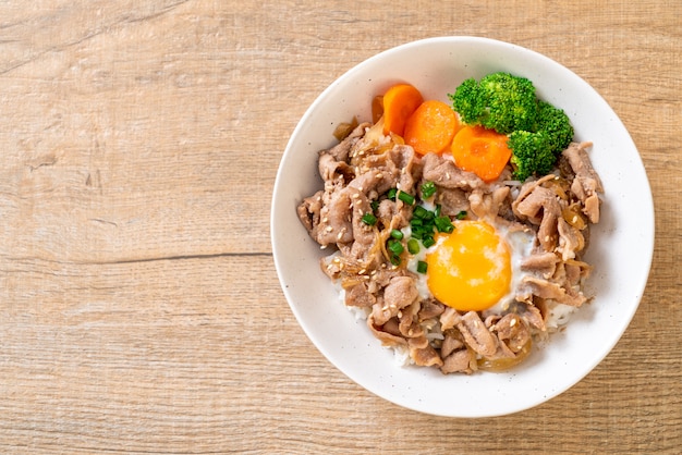 donburi, pork rice bowl with onsen egg and vegetable