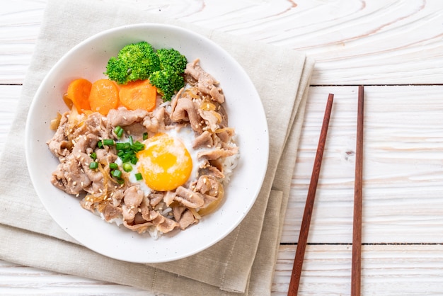 donburi, pork rice bowl with onsen egg and vegetable