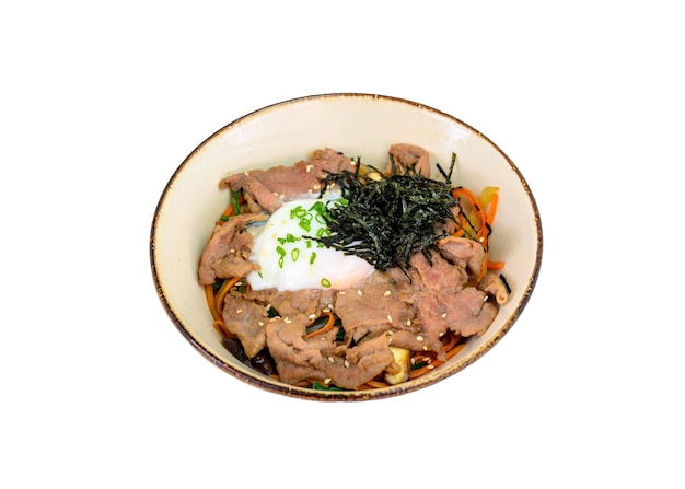 Donburi wagyu beef slices with onsen egg rice vegetables in ceramic bowl