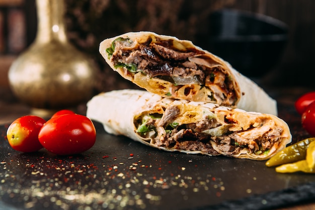 Doner kebab roll turkish dish with marinated meat