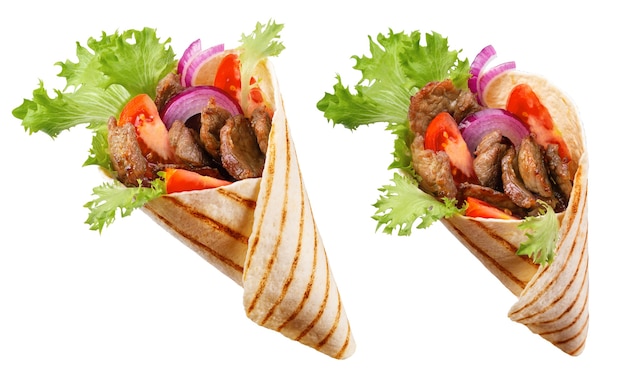 Photo doner kebab or shawarma with ingredients: beef meat, lettuce, onion, tomatoes, spice.