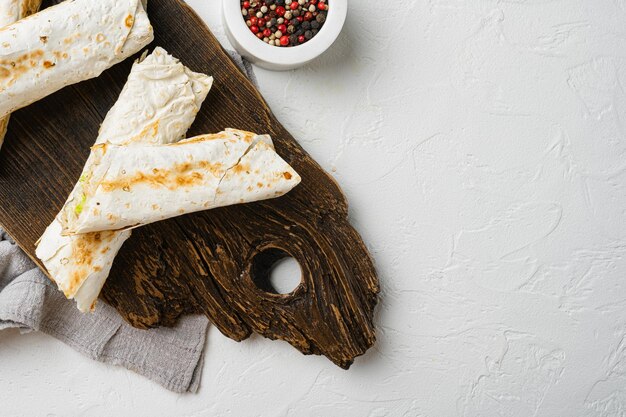 Doner kebab shawarma with vegetables on cutting board