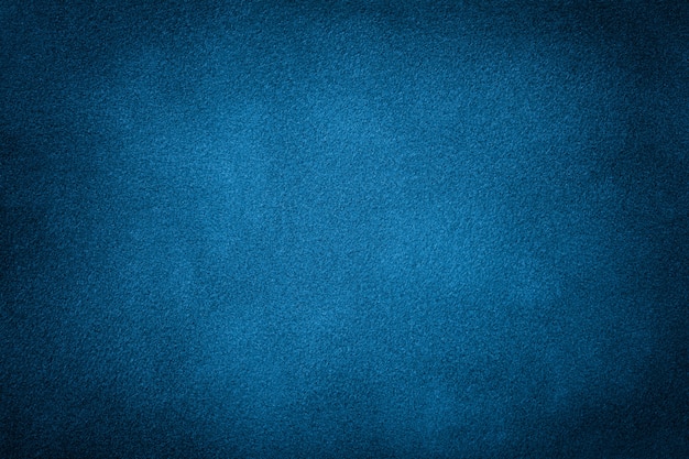 Donkerblauwe matte achtergrond van suede stof