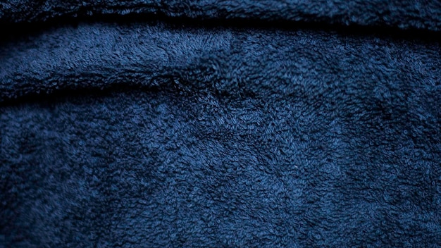Donkere blauwe fluweel stof textuur gebruikt als achtergrond Hemelkleur panne stof achtergrond van zacht en glad textiel materiaal verpletterd fluweel luxe kobalt toon voor zijde