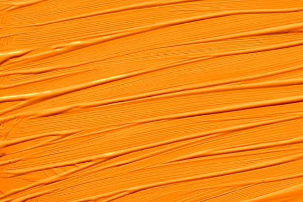 Donkere cheddar oranje trendy kleur van het jaar 2020. Abstracte kunst achtergrond met penseelstreken. Monochrome kleurentextuur.