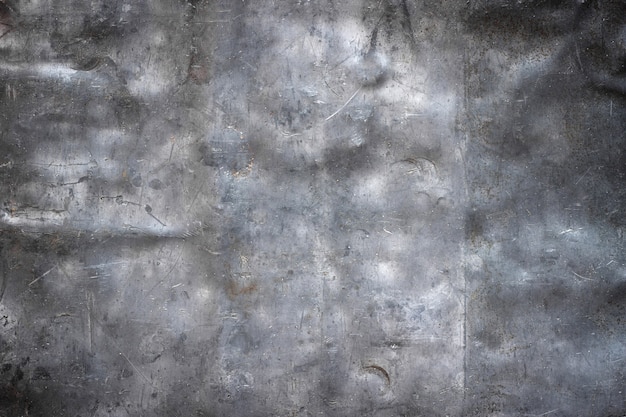 Foto donkere grunge metalen achtergrond, zwarte ijzeren textuur close-up
