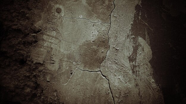 Donkere oude cementtextuurachtergrond, de muren zitten vol vlekken en krassen