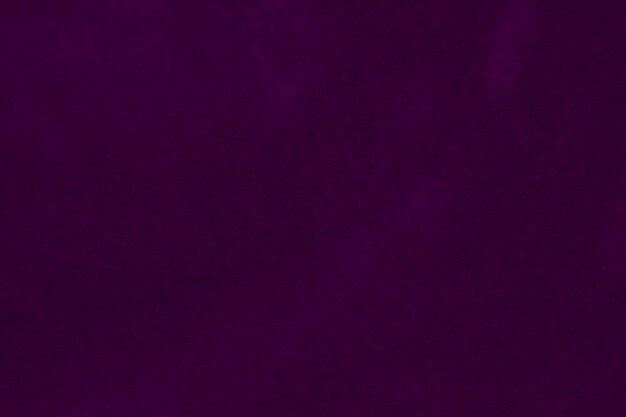 Foto donkere paarse fluweel stof textuur gebruikt als achtergrond violette kleur paarse stof achtergrond van zacht en glad textiel materiaal verpletterd fluweel luxe donkere toon voor zijde