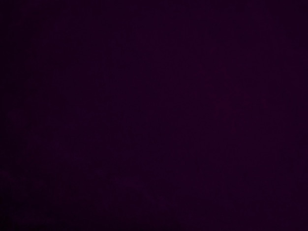 Donkerpaarse fluwelen stoftextuur gebruikt als achtergrond Violette kleur panne stof achtergrond van zacht en glad textielmateriaal verpletterd fluweel luxe magenta toon voor zijde