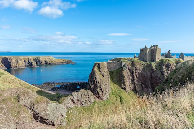 Donnottarr Castle in Scotland on the North Sea coast beautiful landscape