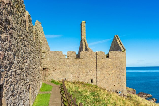 Donnottarr Castle in Scotland on the North Sea coast beautiful landscape