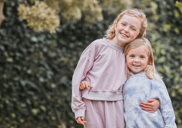 Dont believe in angels You havent seen my sister Shot of two adorable little girls having fun in a garden