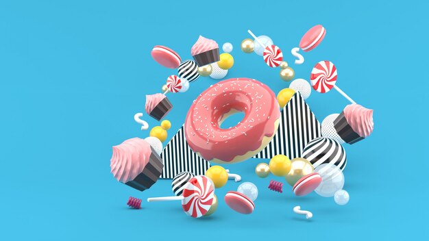 Donut, Cupcakes, Macaron, Candy zwevend tussen kleurrijke ballen op blauw. 3D render