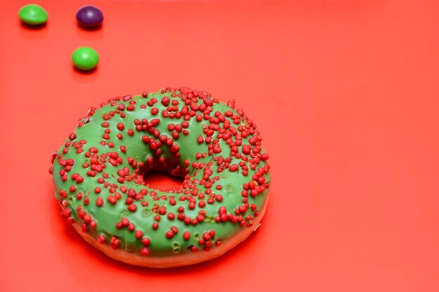 Donut in glaze on a red background