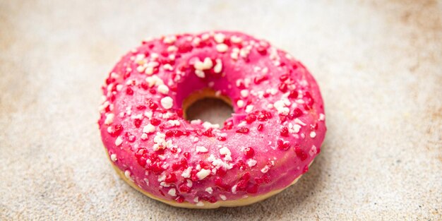 donut roze zoet dessert maaltijd eten snack op tafel kopieer ruimte voedsel achtergrond