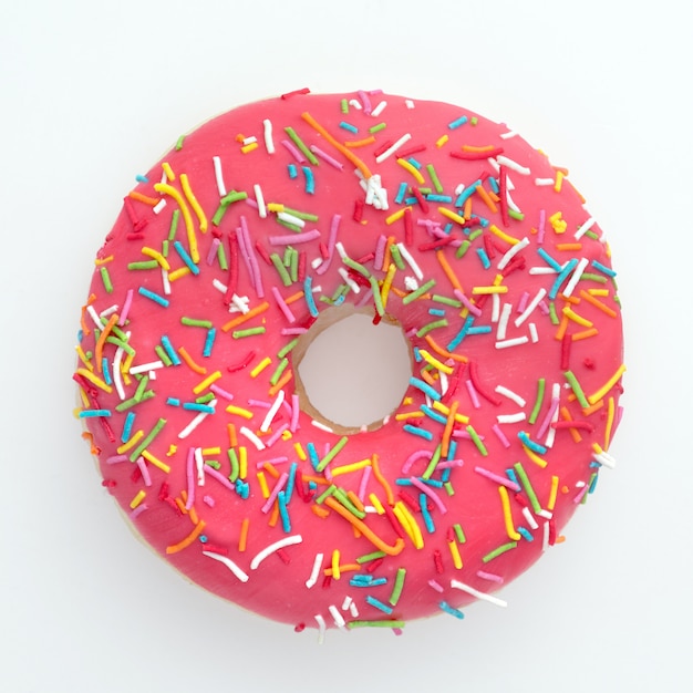 Donut with colorful sprinkles isolated