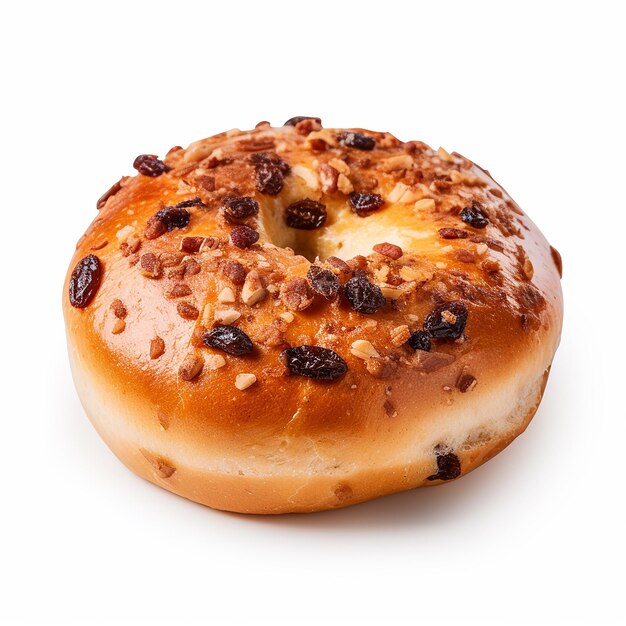 a donut with nuts on it sits on a table