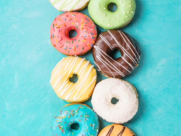 donuts on blue background top view