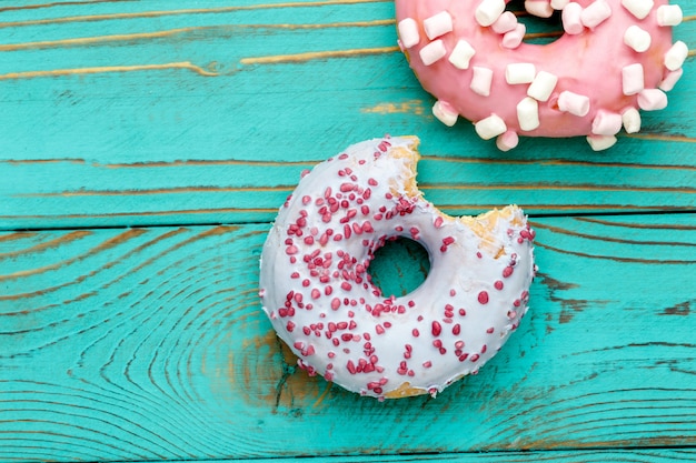 Donuts on colorful wooden table